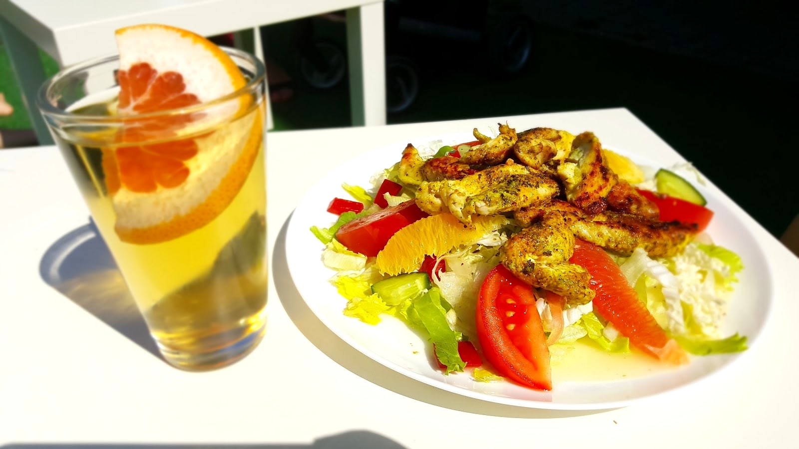 Fresh salad and orange drink